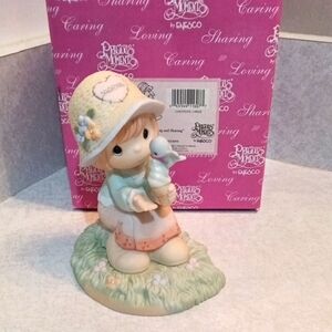 Precious Moments Girl with Bird in Pastel Colors.